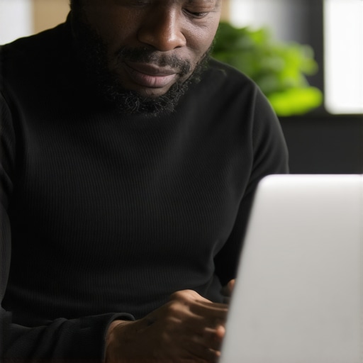 Business owner fine-tuning Google My Business listing on laptop
